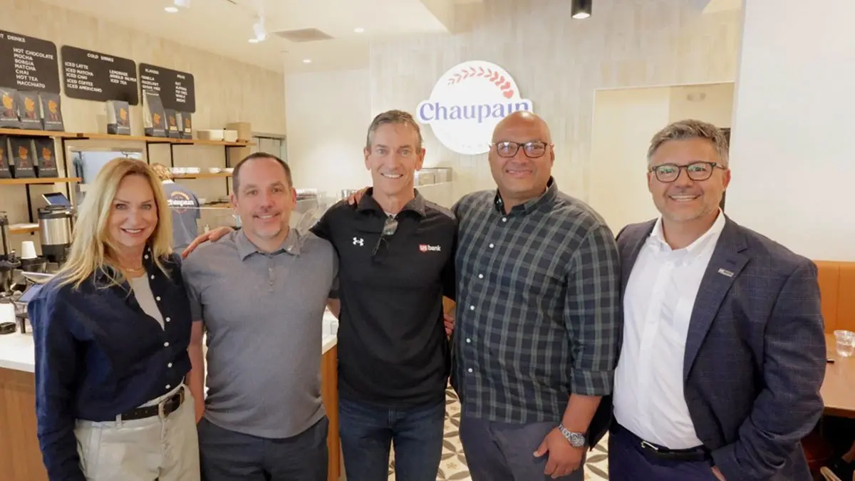 Three women in classroom setting.