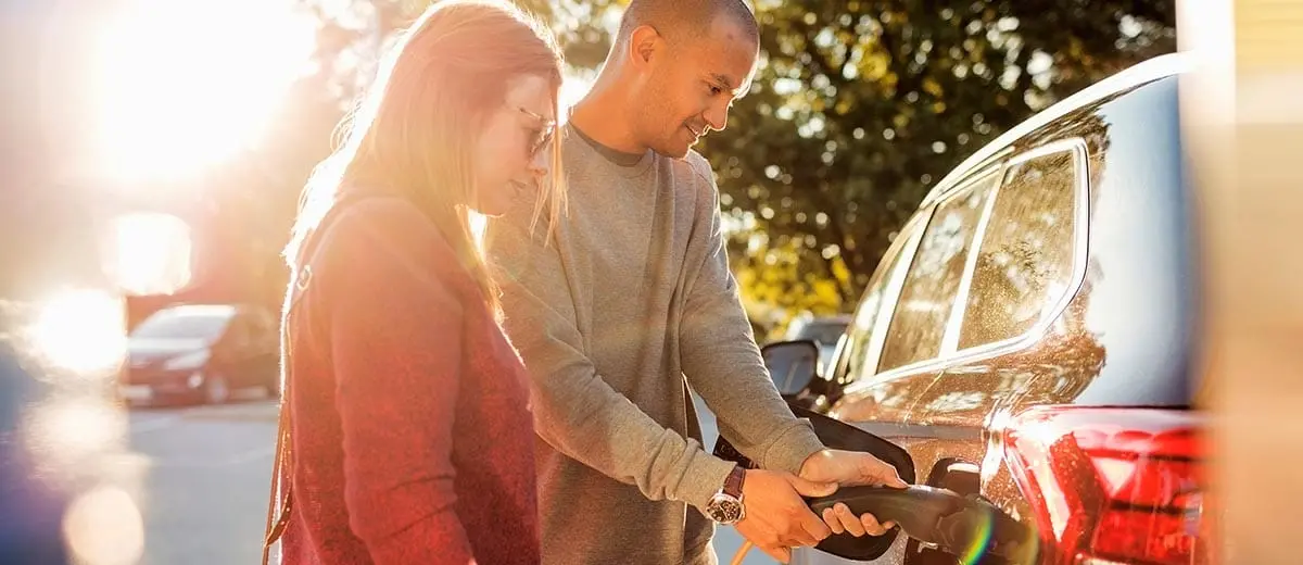 Couple charging Electric vehicle