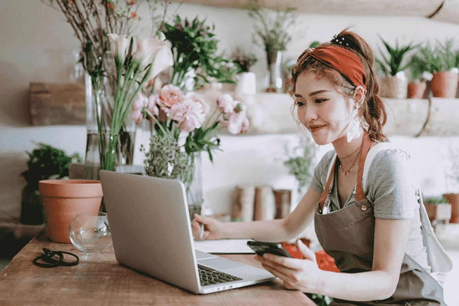 Business owner looking at a laptop