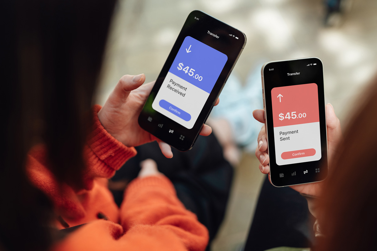 two people transferring money between their phones