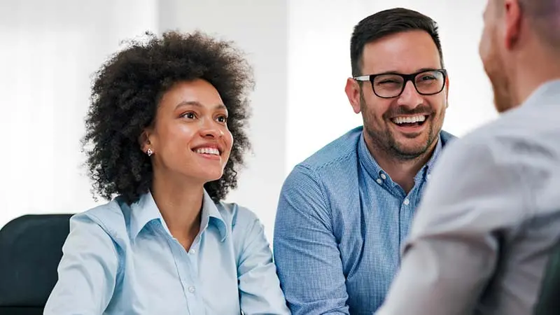 Bearded man using a tablet to read about alternative fund servicing