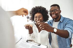 Couple getting keys to their new home