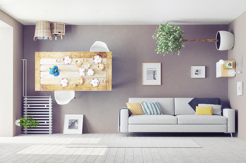 a living room with decorations hung on the wall
