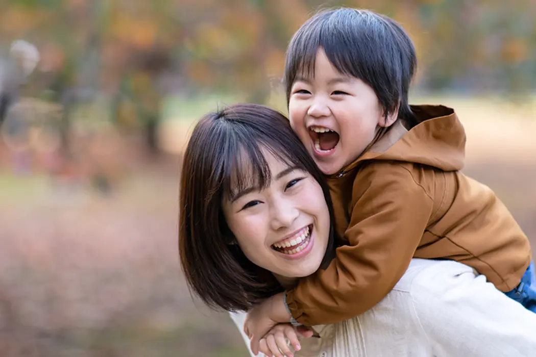 Young mother and son outside