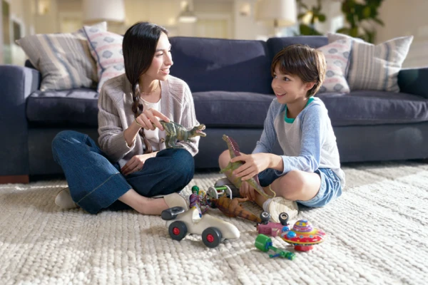 Mom and son playing with dinosaurs
