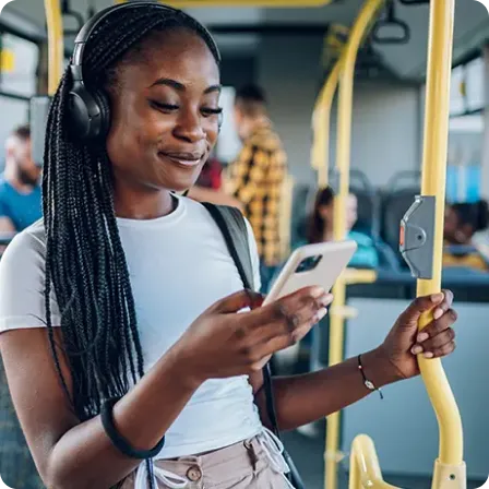 Student checking her phone during a commute