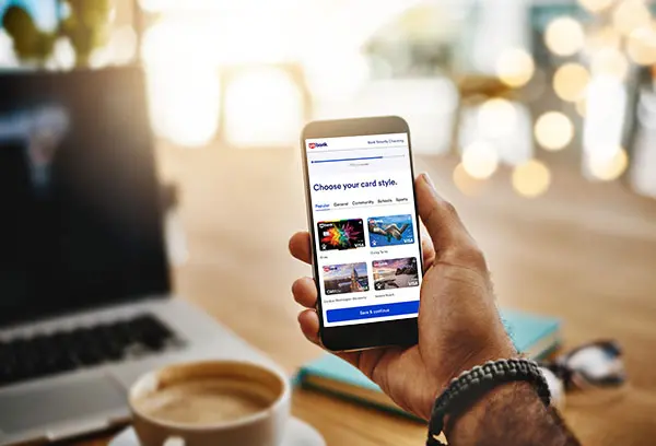 Client viewing debit card options on phone.