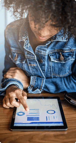 Woman managing account on tablet computer.