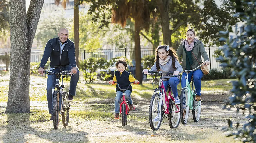 Family riding bikes together