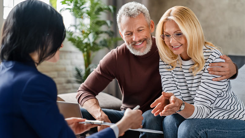 Middle aged couple meeting with a financial advisor
