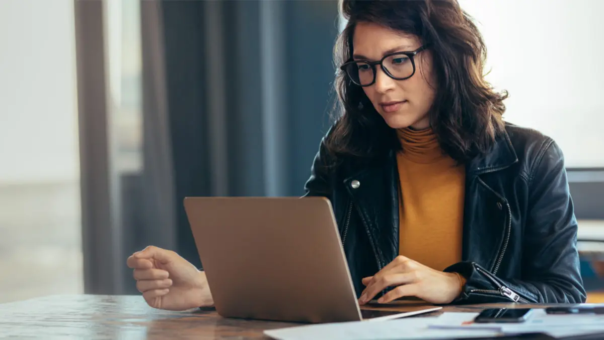 woman reviewing financial leverage options on laptop