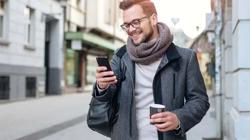 man looking at phone