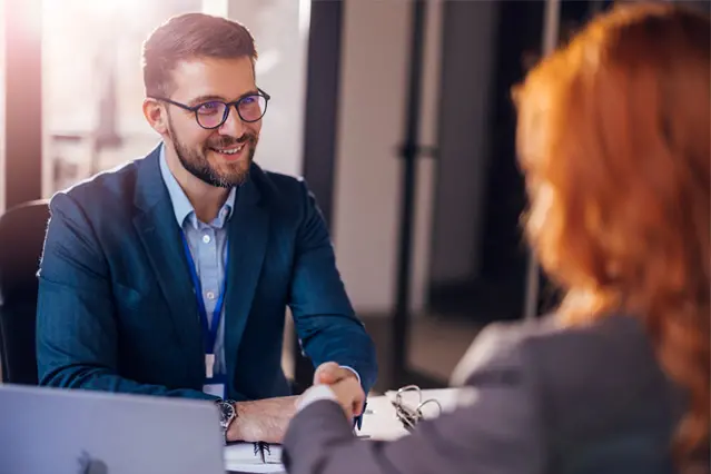 Customer meeting with a financial advisor at a desk