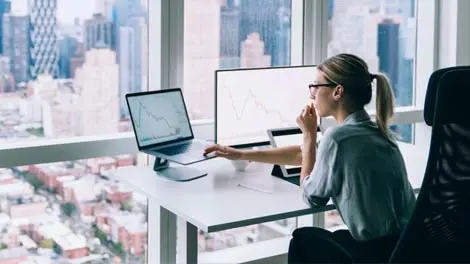 Business professional working in office at desk