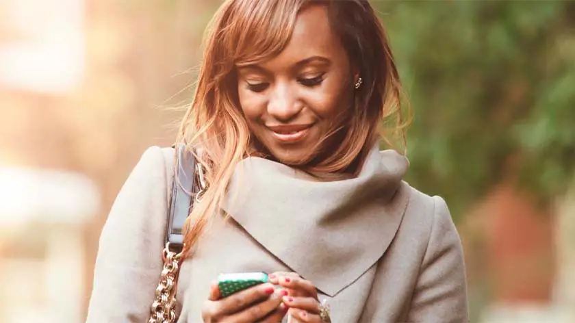 Women walking outside on phone