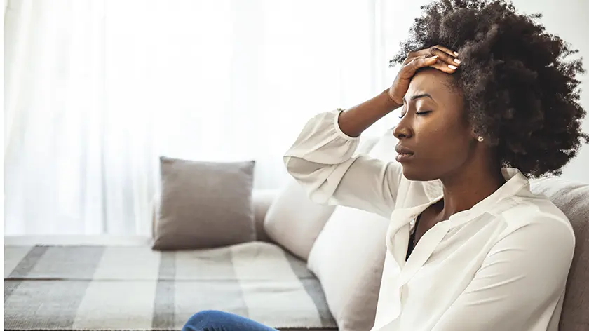 woman sitting in front of a window 
