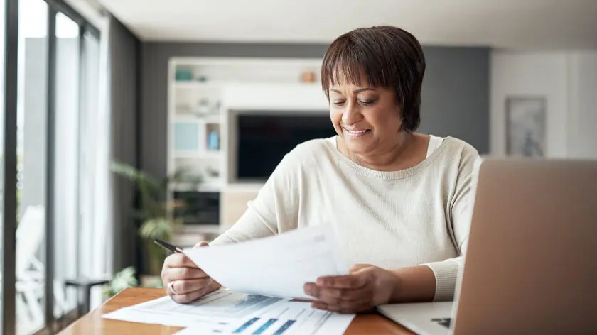 Business woman looking at laptop
