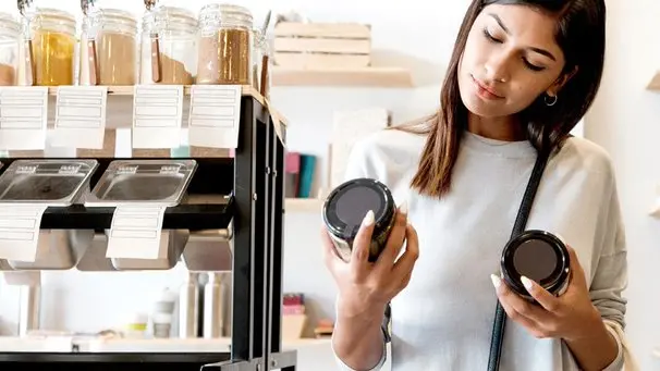woman comparing lables in a store