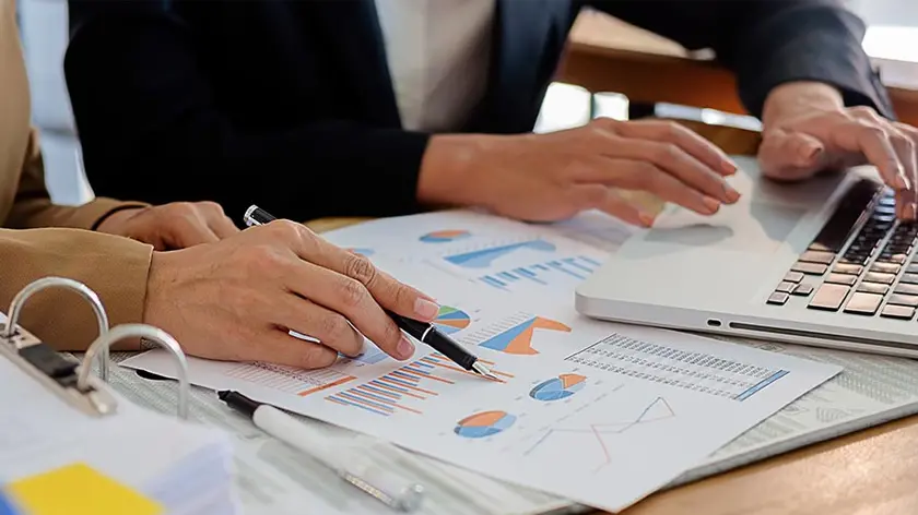 co-workers reviewing investment portfolios