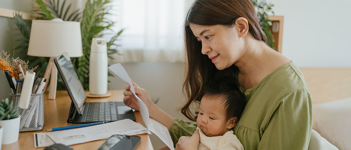 woman working on her finances on a laptop