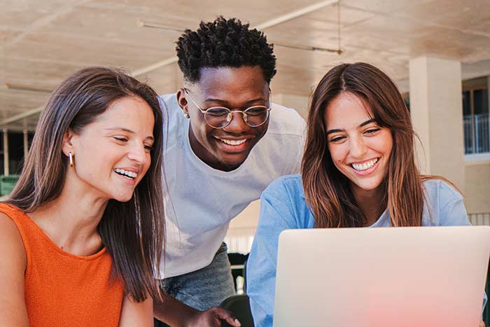 Students gathered around a computer