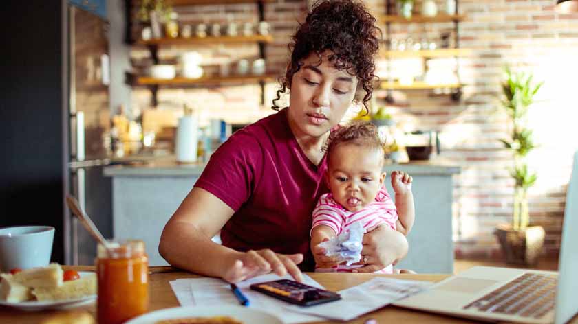 Photo of woman working at kitchen table