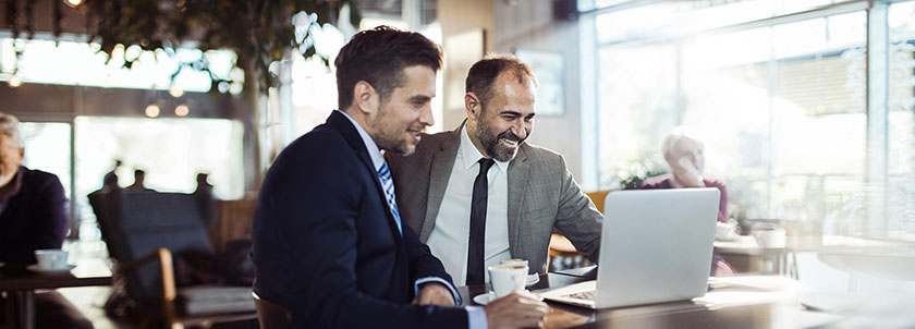 Two men discussing business transition strategies